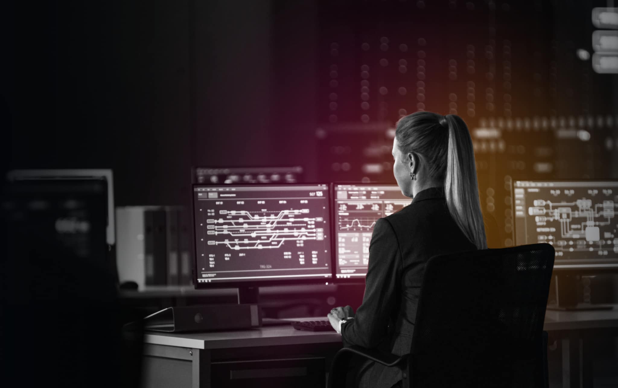 woman sitting in front of desktop